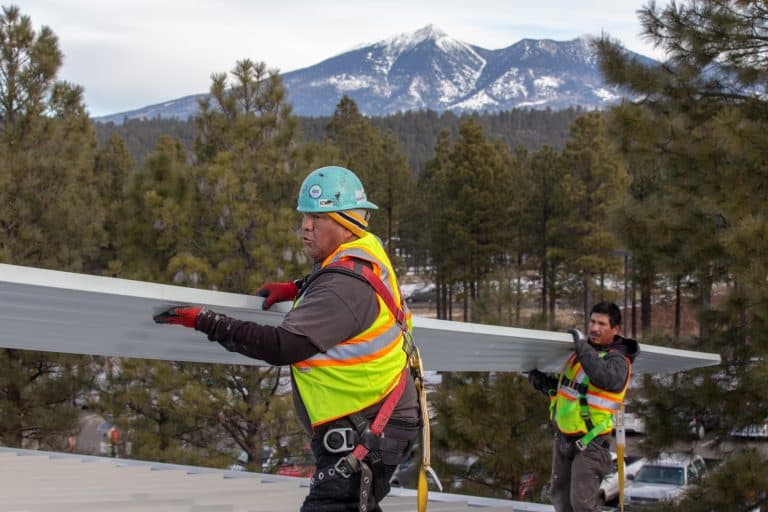workers roofing flagstaff sheet metal roof
