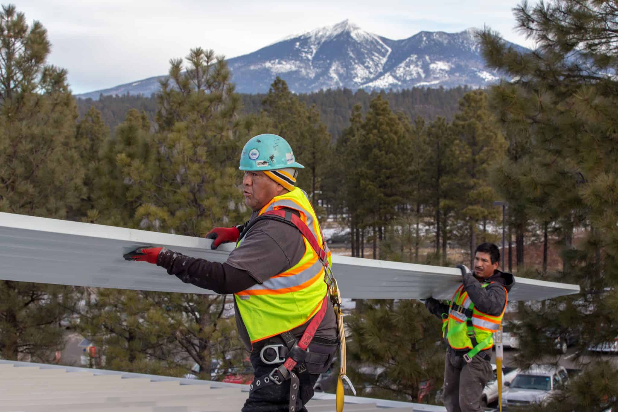 workers roofing flagstaff sheet metal roof